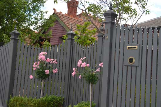 House and fence displaying Capitals