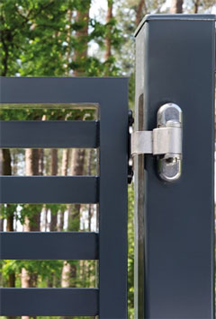 3 way hinge installed on a gate post