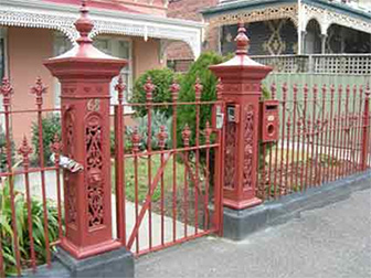 Wrought iron qate with lion post