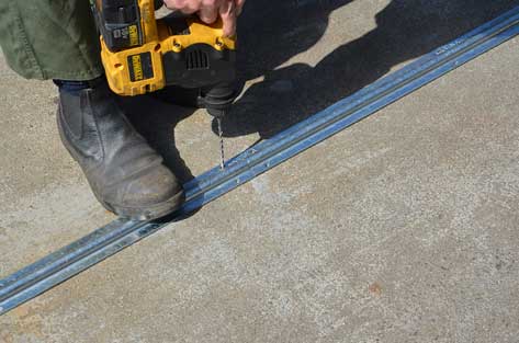 drill holes for sliding gate track
